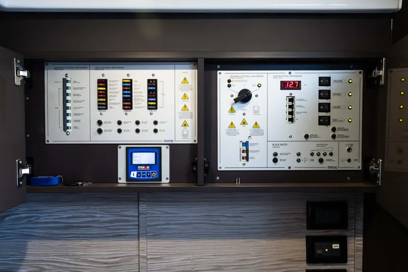 Slide: The Image of Electrical control panel on 2019 Azimut Atlantis 43 yacht, featuring switches and digital display. - 38