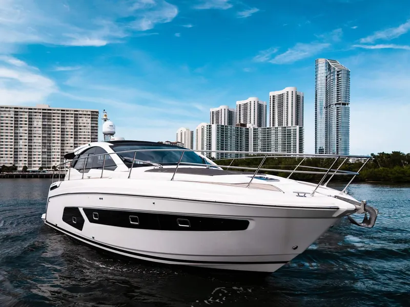 Slide: The Image of 2019 Azimut Atlantis 43 yacht cruising near modern city skyline. - 41