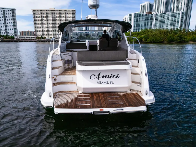 Slide: The Image of Azimut Atlantis 43 yacht, 2019 model, docked in Miami with city skyline backdrop. - 7
