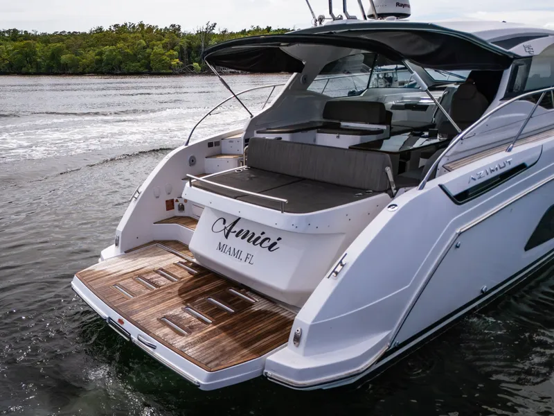 Slide: The Image of 2019 Azimut Atlantis 43 yacht with wooden deck, docked in Miami waters. - 9