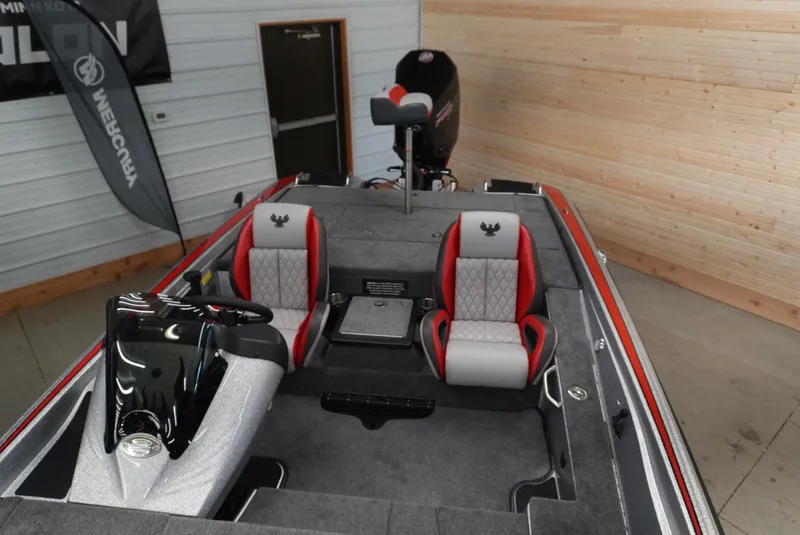 Slide: The Image of 2026 Phoenix 721 ZXL boat interior with red and gray seats, steering console, and motor. - 13