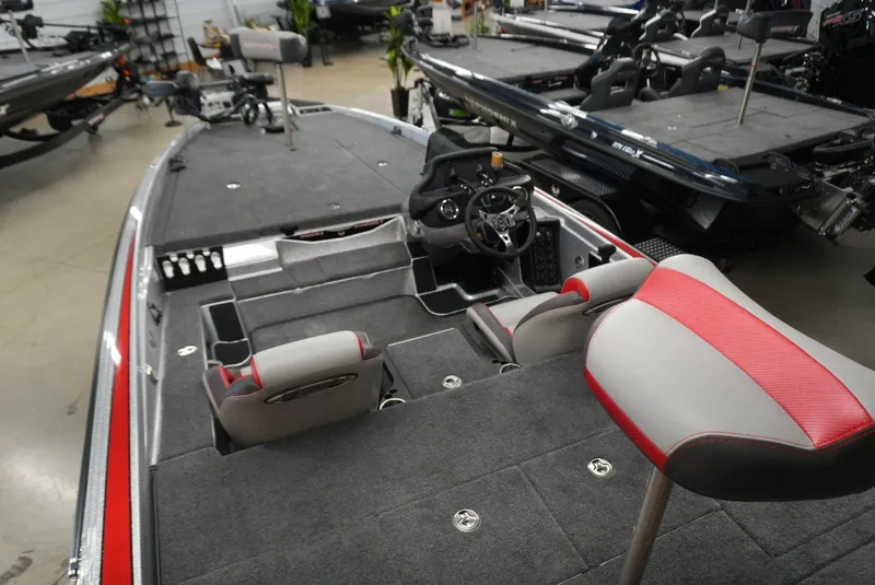 Slide: The Image of 2026 Phoenix 721 ZXL boat interior with gray and red seating, steering console, and spacious deck. - 15