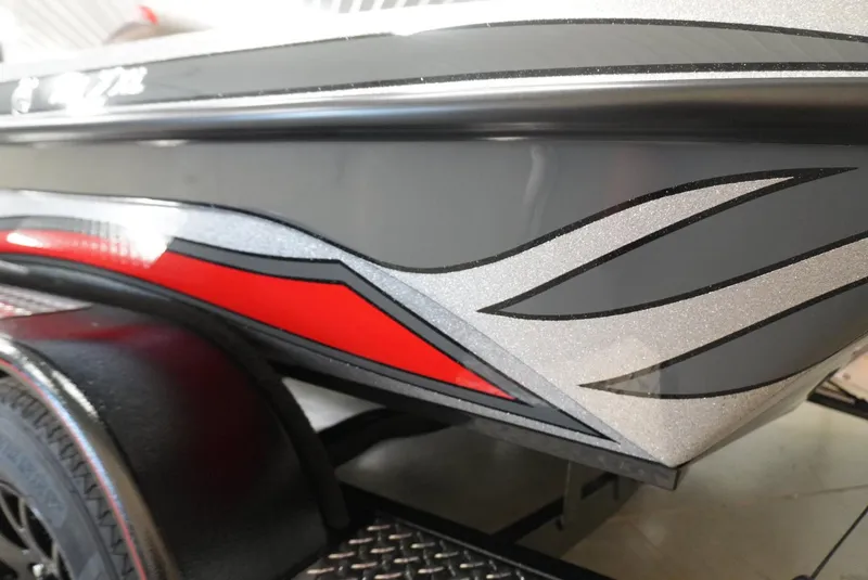 Slide: The Image of 2026 Phoenix 721 ZXL boat with sleek red and silver graphics on the side. - 16
