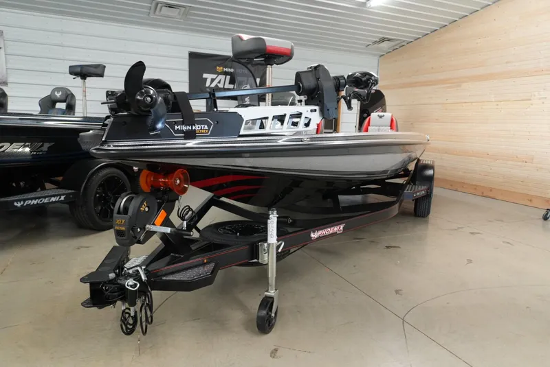 Slide: The Image of 2026 Phoenix 721 ZXL boat in showroom, featuring Minn Kota Ultrex trolling motor. - 3