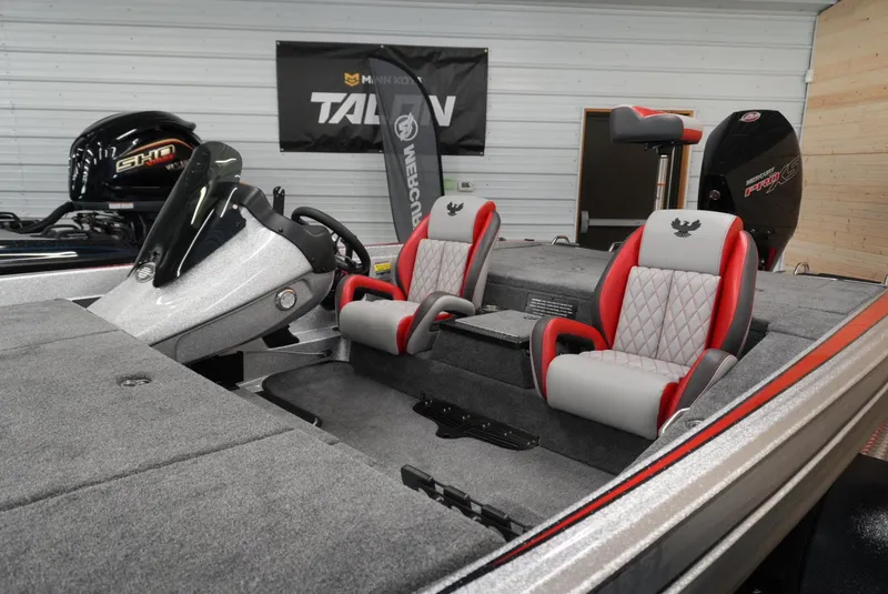 Slide: The Image of 2026 Phoenix 721 ZXL boat interior with red and gray seats, steering console, and motor. - 7