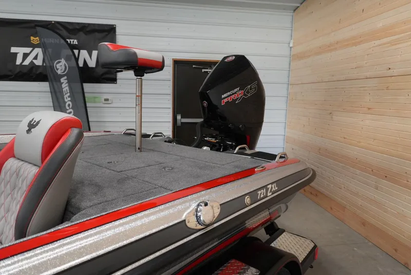 Slide: The Image of 2026 Phoenix 721 ZXL boat with Mercury Pro XS engine in showroom. - 8