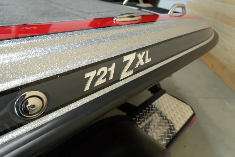 Slide: The Image of Close-up of 2026 Phoenix 721 ZXL boat with metallic finish and logo. - 9