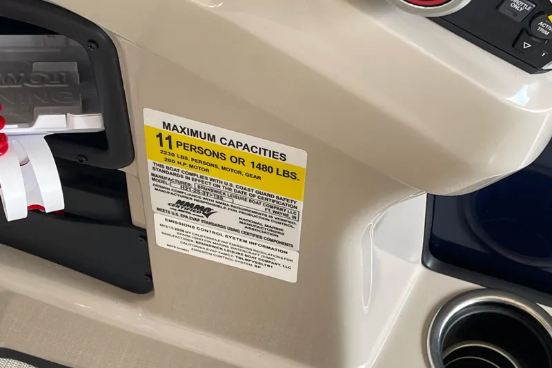 Slide: The Image of 2026 Harris Cruiser 210 capacity label, maximum 11 persons or 1480 lbs, beige interior. - 10