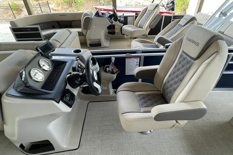 Slide: The Image of 2026 Harris Cruiser 210 boat interior with luxurious seating and modern dashboard. - 11