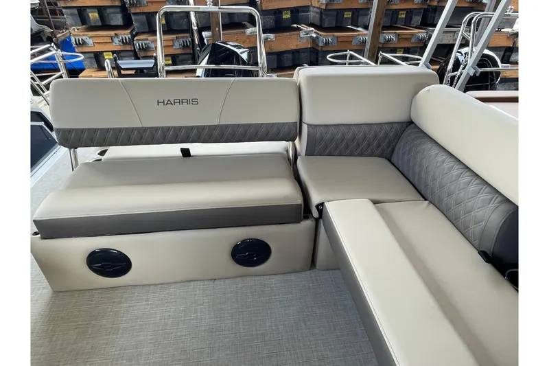 Slide: The Image of 2026 Harris Cruiser 210 boat interior with luxurious seating and quilted upholstery. - 12