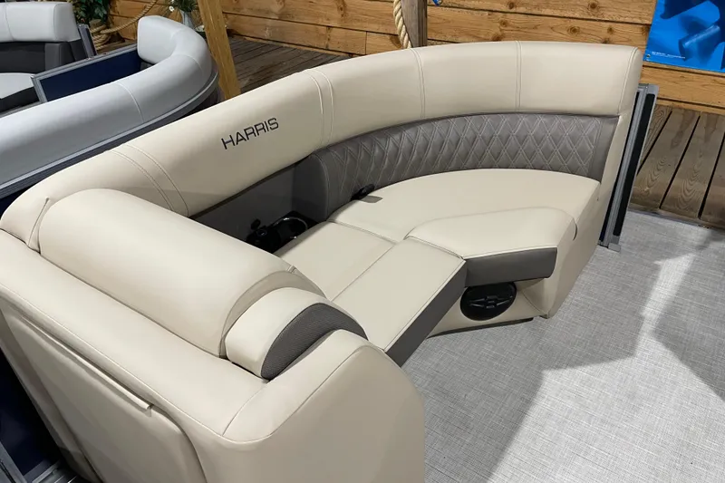 Slide: The Image of Luxurious seating on 2026 Harris Cruiser 210 pontoon boat, featuring elegant beige upholstery. - 6