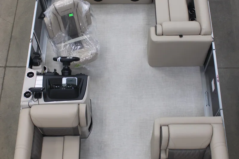 Slide: The Image of 2026 Harris Cruiser 210 interior with beige seating and modern helm design. - 8