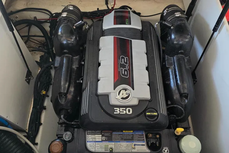 Slide: The Image of 2019 Sea Ray SDX 290 engine compartment featuring a MerCruiser 6.2L 350 HP engine. - 17