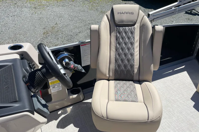 Slide: The Image of Captain's seat and steering wheel of 2026 Harris Cruiser 210 boat. - 9