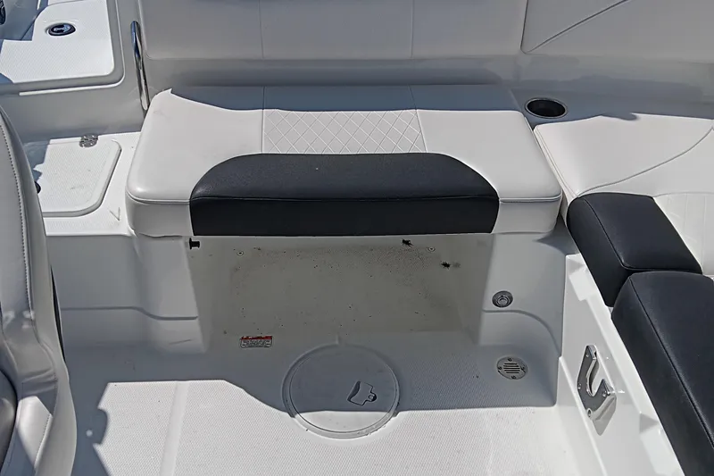 Slide: The Image of Interior seating of a 2017 Tahoe 1950 boat, featuring white and black upholstery. - 11
