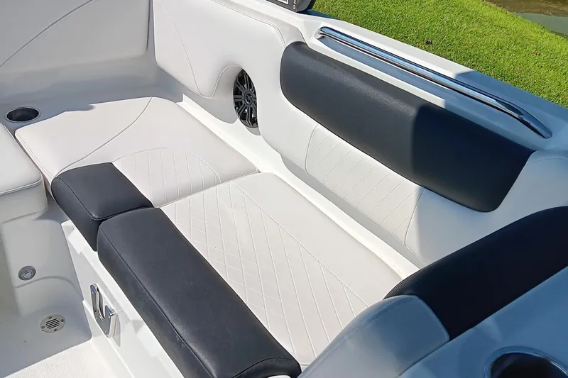 Slide: The Image of Luxurious seating in a 2017 Tahoe 1950 boat, featuring black and white upholstery. - 12