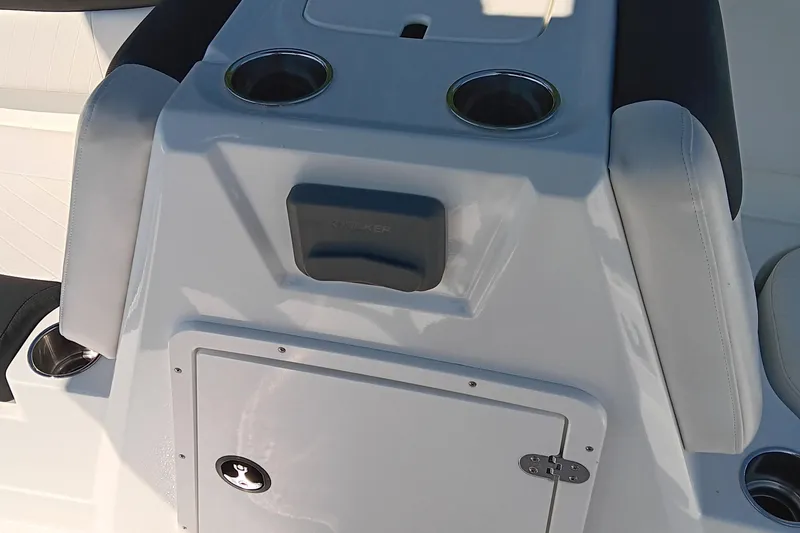 Slide: The Image of 2017 Tahoe 1950 boat console with cup holders and storage compartment. - 13