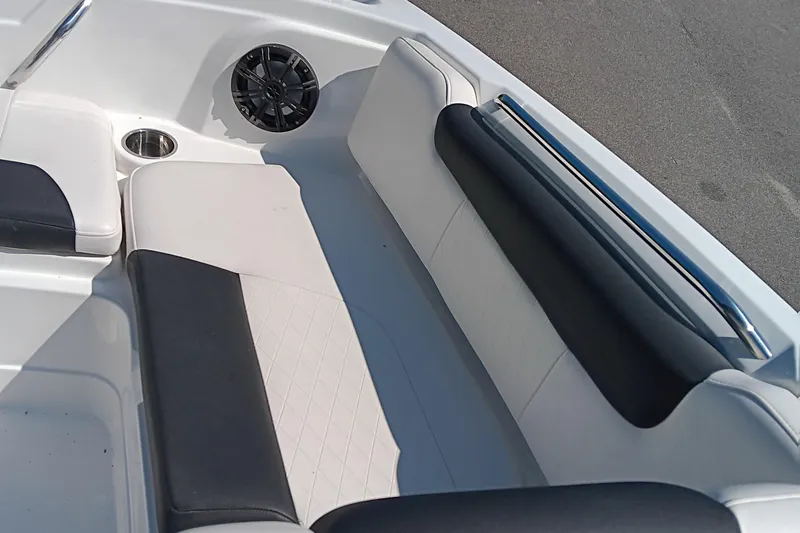 Slide: The Image of Interior seating of a 2017 Tahoe 1950 boat with black and white upholstery. - 7