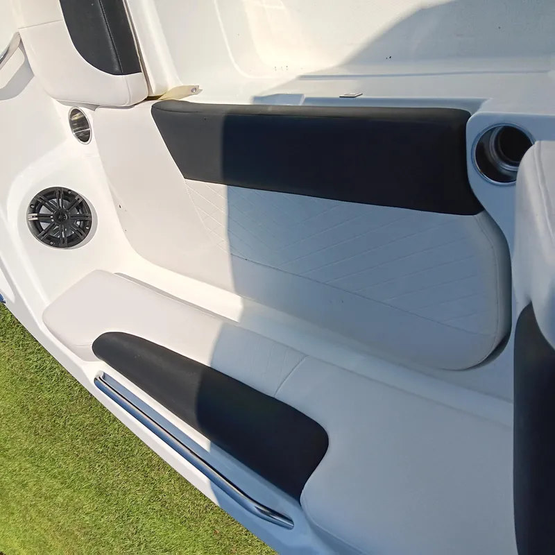 Slide: The Image of Interior of a 2017 Tahoe 1950 boat with black and white seating. - 8