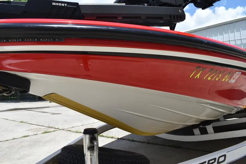 Slide: The Image of Red and white 2008 Nitro z9cdc boat on trailer, side view. - 13