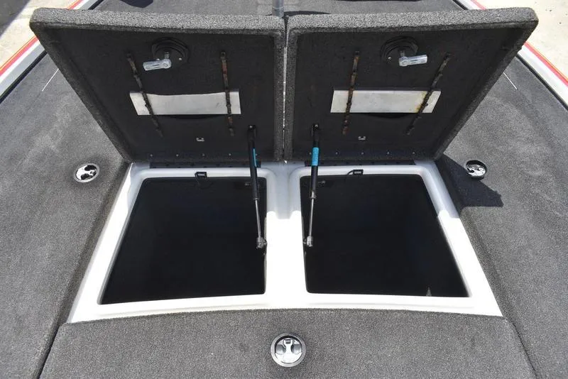 Slide: The Image of 2008 Nitro z9cdc boat storage compartments open, showcasing interior space. - 26