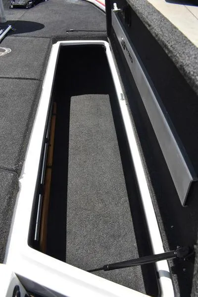 Slide: The Image of Open storage compartment in a 2008 Nitro z9cdc boat, featuring carpeted interior. - 27