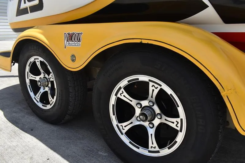 Slide: The Image of Yellow Nitro Z9 CDC 2008 trailer with stylish black and white wheels. - 3