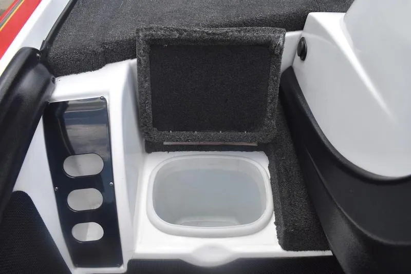 Slide: The Image of Interior compartment of a 2008 Nitro z9cdc boat, featuring a storage area with carpet lining. - 33