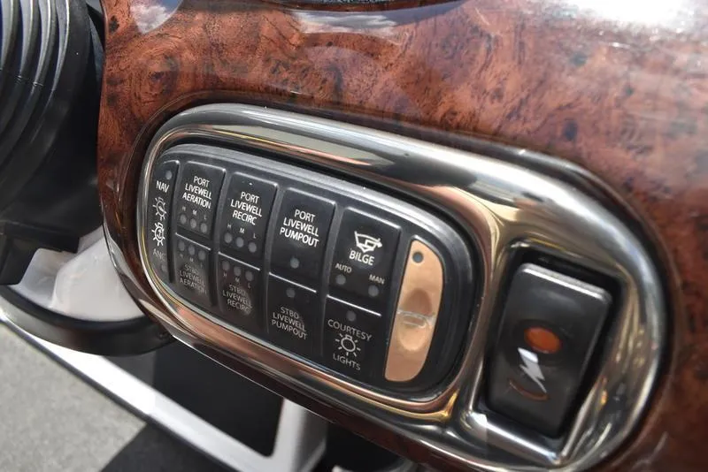 Slide: The Image of Control panel of a 2008 Nitro z9cdc boat with various switches and buttons. - 39