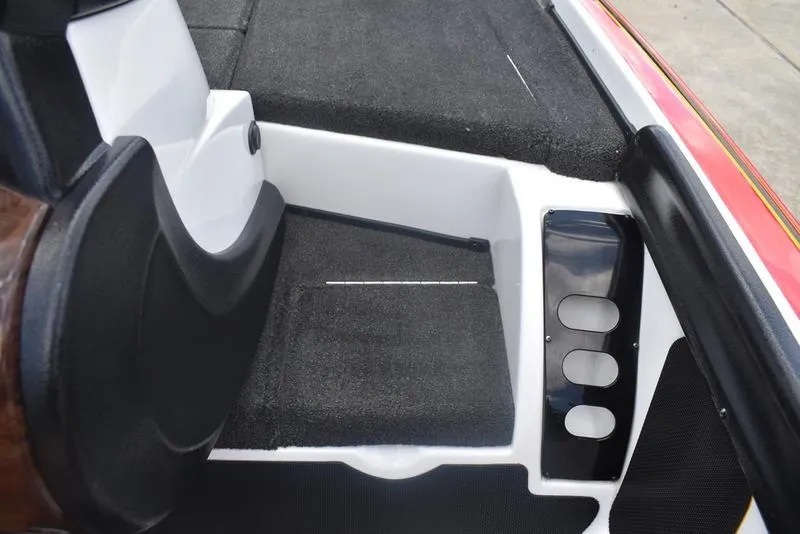 Slide: The Image of 2008 Nitro z9cdc boat interior with black carpet and white accents. - 41