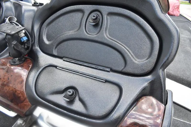 Slide: The Image of 2008 Nitro z9cdc boat dashboard with black panel and wood accents. - 43