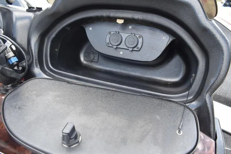 Slide: The Image of Storage compartment of a 2008 Nitro z9cdc boat with dual power outlets. - 45