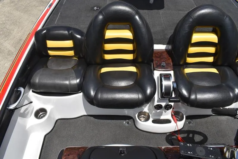 Slide: The Image of 2008 Nitro z9cdc boat interior with black and yellow seats, steering, and controls. - 47