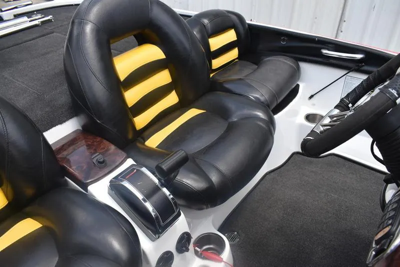 Slide: The Image of 2008 Nitro z9cdc boat interior with black and yellow seats, steering wheel, and controls. - 50