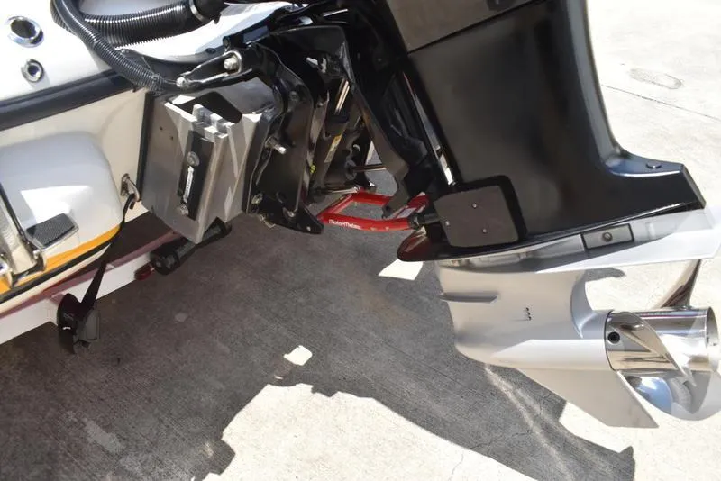 Slide: The Image of Close-up of a 2008 Nitro z9cdc boat motor and propeller on concrete surface. - 9