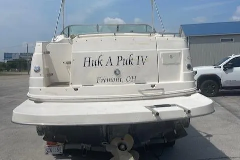Slide: The Image of 2002 Rinker 250 FV boat named "Huk A Puk IV" in a parking lot, Fremont, OH. - 11