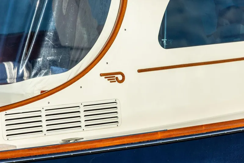 Slide: The Image of Hinckley Picnic Boat Mark III 2011, featuring elegant wood trim and sleek design details. - 26