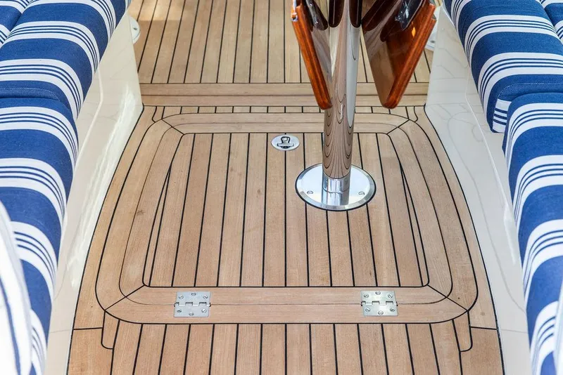 Slide: The Image of Teak deck and striped seating on 2011 Hinckley Picnic Boat Mark III. - 34