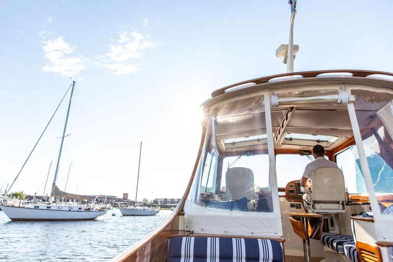 Slide: The Image of 2011 Hinckley Picnic Boat Mark III cruising on a sunny day with sailboats nearby. - 35