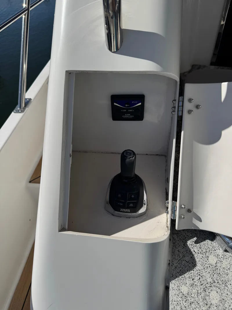 Slide: The Image of Control panel on a 2012 Neptunus 62 Flybridge yacht, featuring joystick and display. - 11