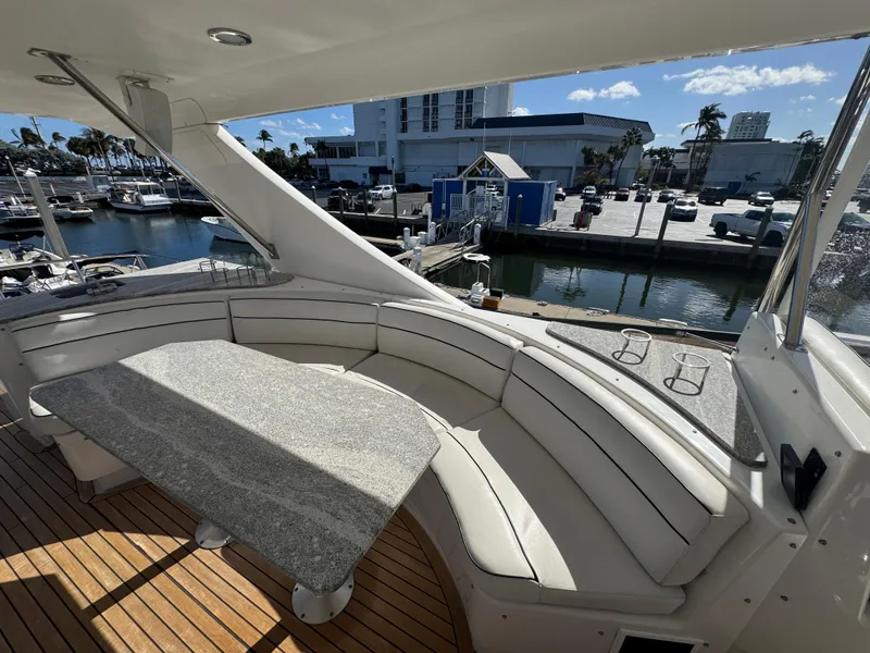 Slide: The Image of Luxurious seating area on 2012 Neptunus 62 Flybridge yacht, docked at marina. - 20