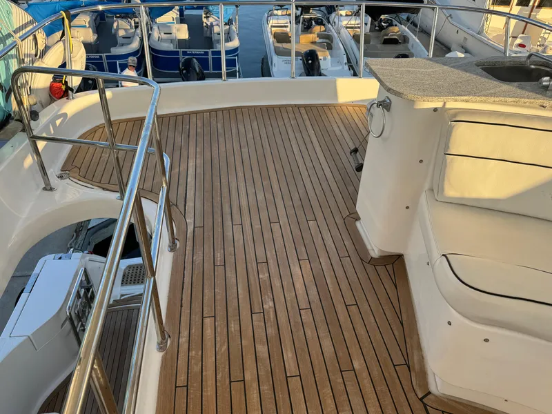 Slide: The Image of Luxurious 2012 Neptunus 62 Flybridge yacht with teak deck and seating area. - 21