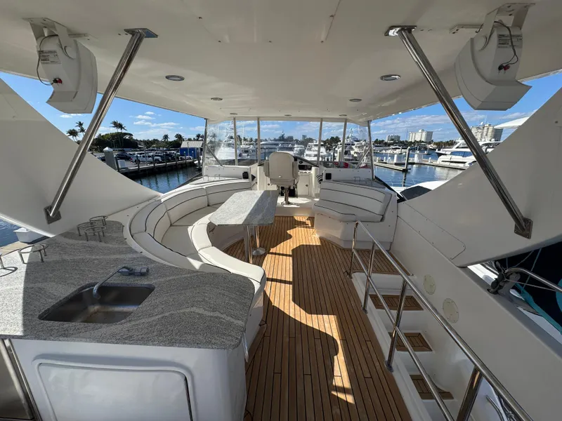 Slide: The Image of Luxurious 2012 Neptunus 62 Flybridge yacht interior with elegant seating and modern amenities. - 22