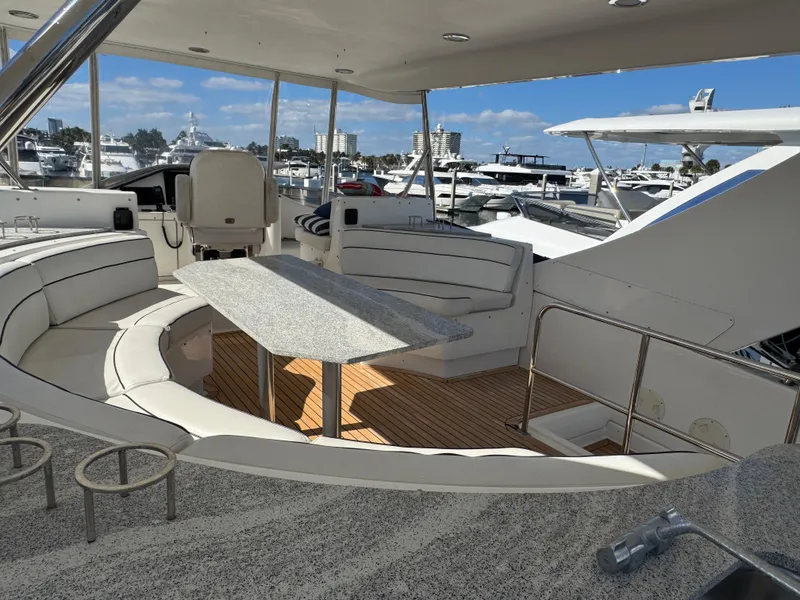 Slide: The Image of Luxurious 2012 Neptunus 62 Flybridge yacht interior with elegant seating and table. - 23