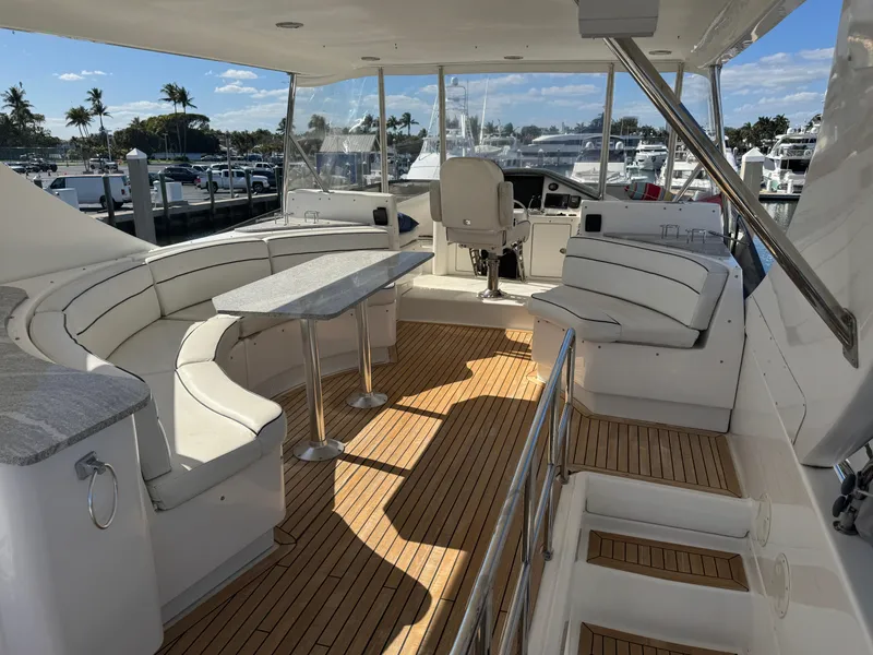 Slide: The Image of Luxurious 2012 Neptunus 62 Flybridge yacht interior with elegant seating and wooden flooring. - 25