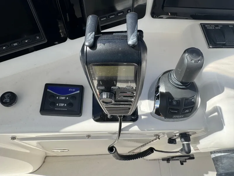 Slide: The Image of Control panel of a 2012 Neptunus 62 Flybridge yacht with communication and navigation equipment. - 28