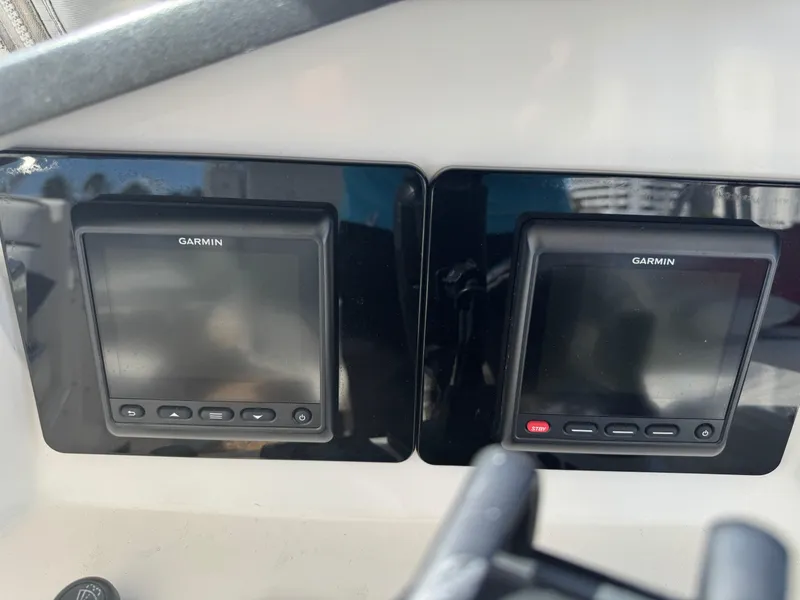 Slide: The Image of Garmin navigation displays on 2012 Neptunus 62 Flybridge yacht dashboard. - 30