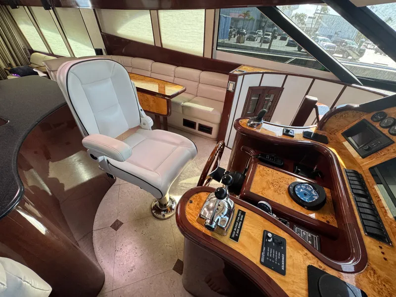 Slide: The Image of Luxurious helm of 2012 Neptunus 62 Flybridge yacht with plush seating and elegant controls. - 32