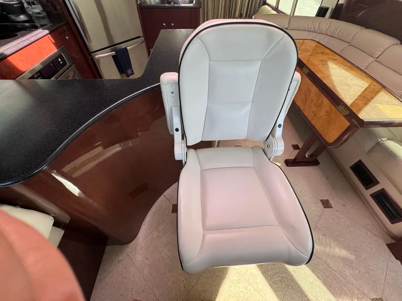 Slide: The Image of Interior of 2012 Neptunus 62 Flybridge yacht with white chair and elegant furnishings. - 34