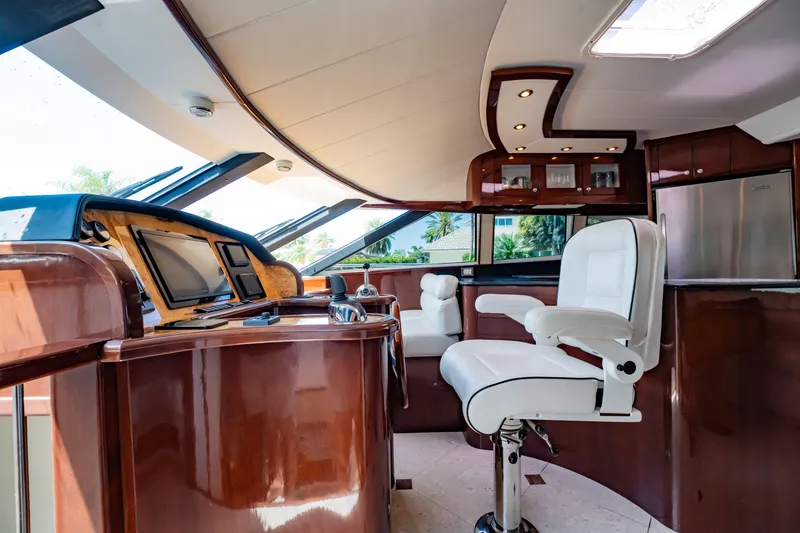 Slide: The Image of Luxurious 2012 Neptunus 62 Flybridge yacht interior with sleek helm and plush seating. - 37